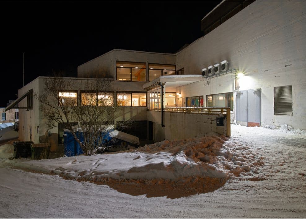 White concrete building in the winter.